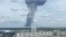 A still image, taken from video footage, shows smoke rising from the site of blasts at an explosives plant in the town of Dzerzhinsk.