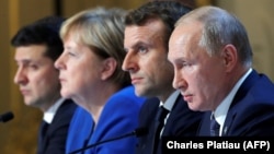 Talking about talking peace:  Ukraine's President Volodymyr Zelenskiy, German Chancellor Angela Merkel, French President Emmanuel Macron, and Russia's President Vladimir Putin attend a press conference after their December 9 summit. 