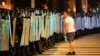 A protester speaks to police blocking a road in Minsk during a protest that followed the Belarusian presidential election on August 9, 2020.