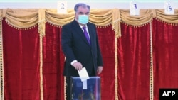 Tajik President Emomali Rakhmon, a presidential candidate for the fifth time, casts his ballot at a polling station in Dushanbe during Tajikistan's presidential election on October 11, 2020, amid the ongoing coronavirus disease pandemic.