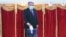 Tajik President Emomali Rakhmon, a presidential candidate for the fifth time, casts his ballot at a polling station in Dushanbe during Tajikistan's presidential election on October 11, 2020, amid the ongoing coronavirus disease pandemic.