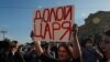 Carrying a sign that declares, in reference to President Vladimir Putin, "Down with the tsar," municipal deputy Yulia Galyamina protests in downtown Moscow on July 1, 2020 against amendments to Russia's constitution.