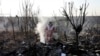  Rescue workers search the scene where an Ukrainian plane crashed in Shahedshahr, southwest of Iran's capital, Tehran, on January 8, 2020. 