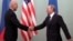 RUSSIA -- Then U.S. Vice President Joe Biden (L) shakes hands with then Russian Prime Minister Vladimir Putin during their meeting in Moscow, March 10, 2011