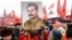 RUSSIA -- Russian Communist party supporters hold portraits of Soviet leader Josef Stalin as they gather to mark the Stalin's 139th birthday on the Red Square, in Moscow, December 21, 2018
