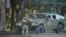 Armored military vehicles carrying armed men in camouflage were seen in Minsk toward the close of voting on August 9, 2020. 