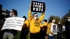 Pennsylvania, U.S. - People hold signs as they take part in a rally demanding a fair count of the votes of the 2020 U.S. presidential election, in Philadelphia