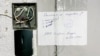A Belarusian Interior Ministry notice on a door of RFE/RL Belarusian Service's Minsk office after security forces' July 16, 2021 raid