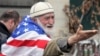 A Georgian demonstrator, known for his affinity for the U.S. flag, attends a 2014 anti-Russia rally in Tbilisi, Georgia.  