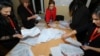 Members of an election commission count ballots at a Baku polling station after early parliamentary elections in Azerbaijan on February 9, 2020.